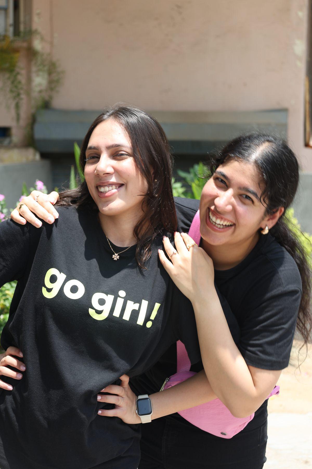 Two Go Girl team members smiling together